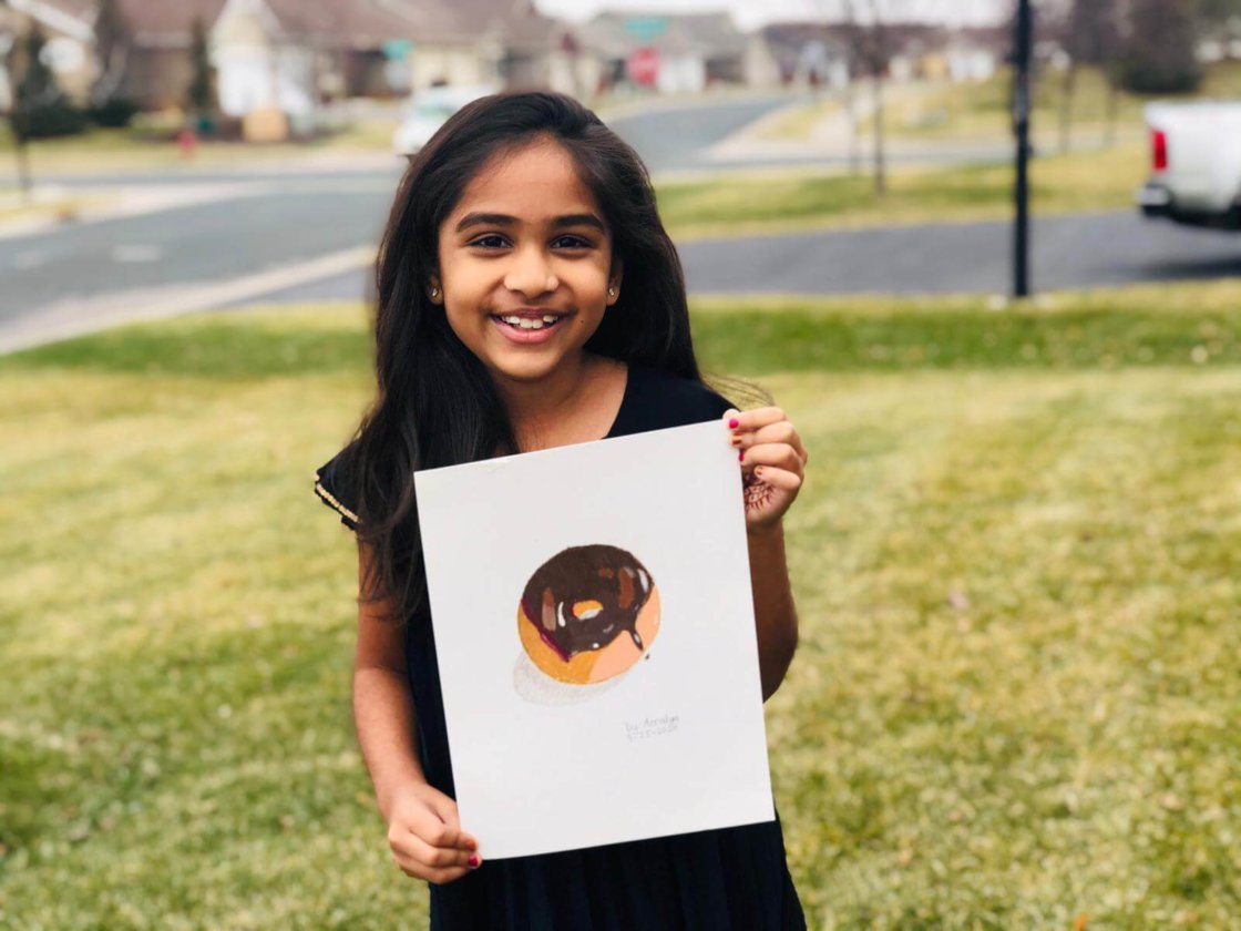 Student at Nimmy's Art online classes with a donut completed in Prisma colors