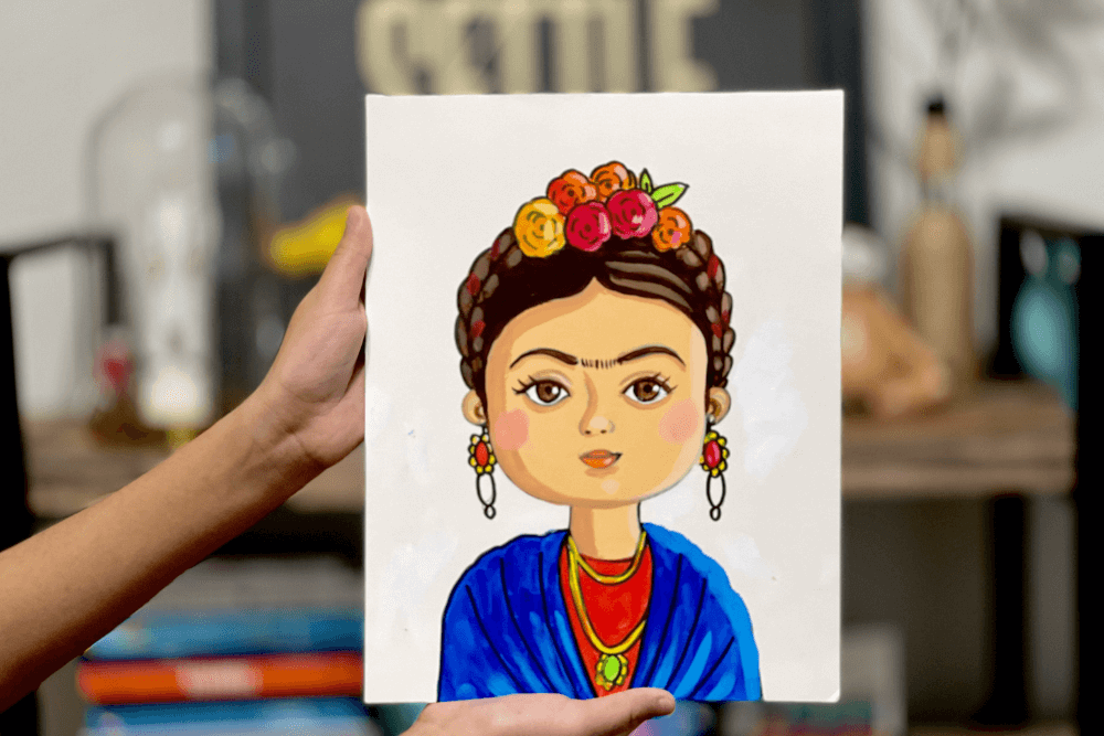 Cartoon illustration of Nimmy teaching kids how to paint a cute Frida Kahlo portrait.