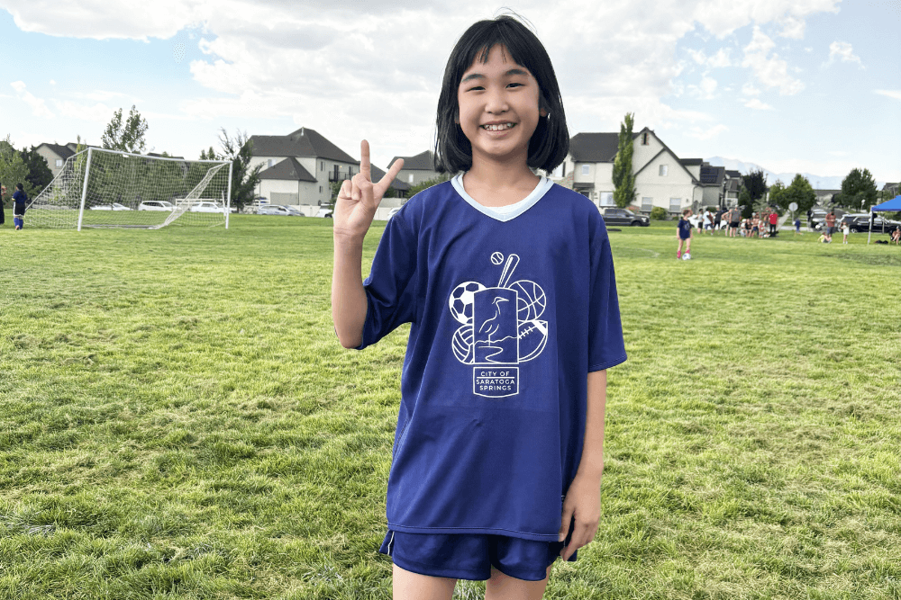 Bella playing soccer at school.